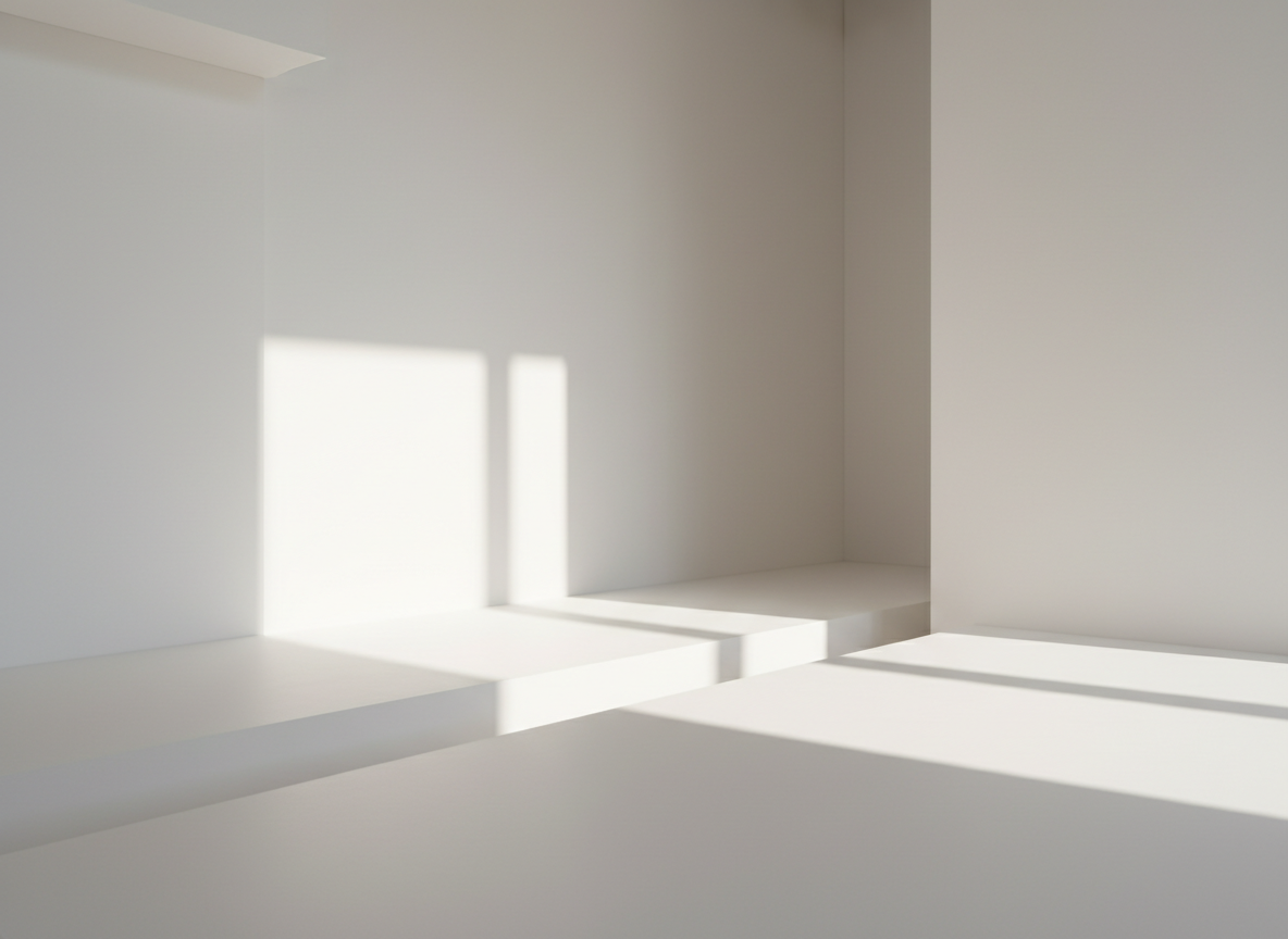 Soft light and shadow on a minimal white surface